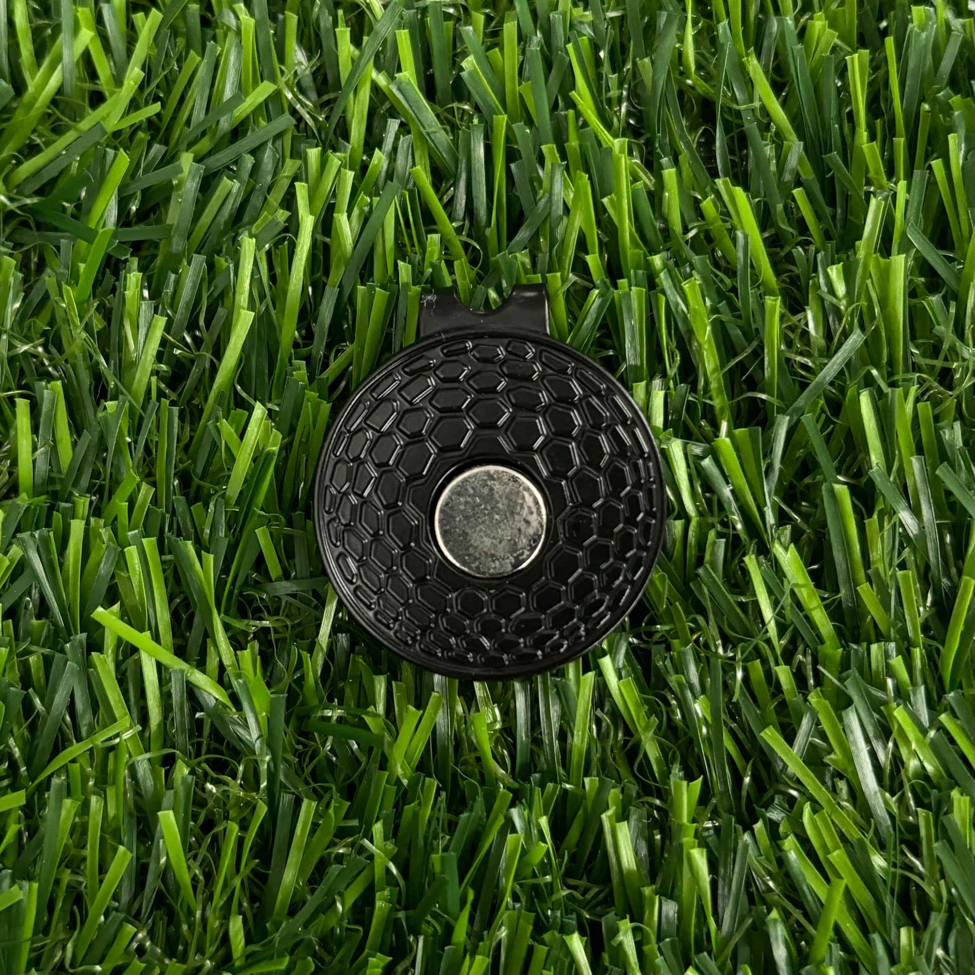 Premium golf ball markers with unique and stylish designs, crafted for durability and enhancing your golf game.