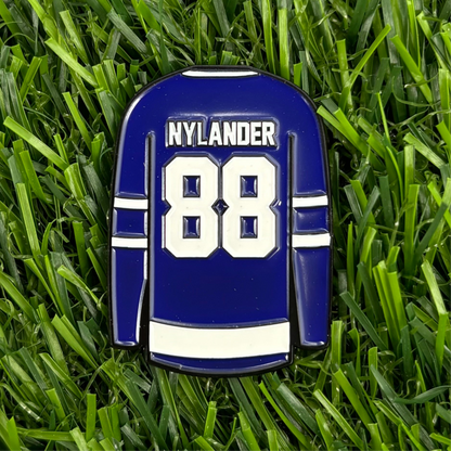 William Nylander custom golf ball marker shaped like a jersey on grass