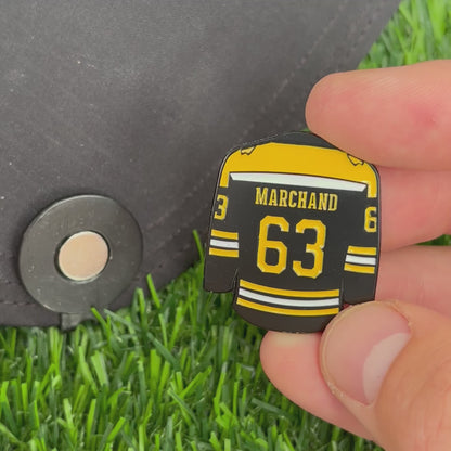 Sandybirds Golf Gear Marchand Ball Marker - Premium quality golf ball marker made of zinc alloy, designed in the shape of a Marchand jersey. A perfect accessory for golf enthusiasts looking to add a touch of style and precision to their game.